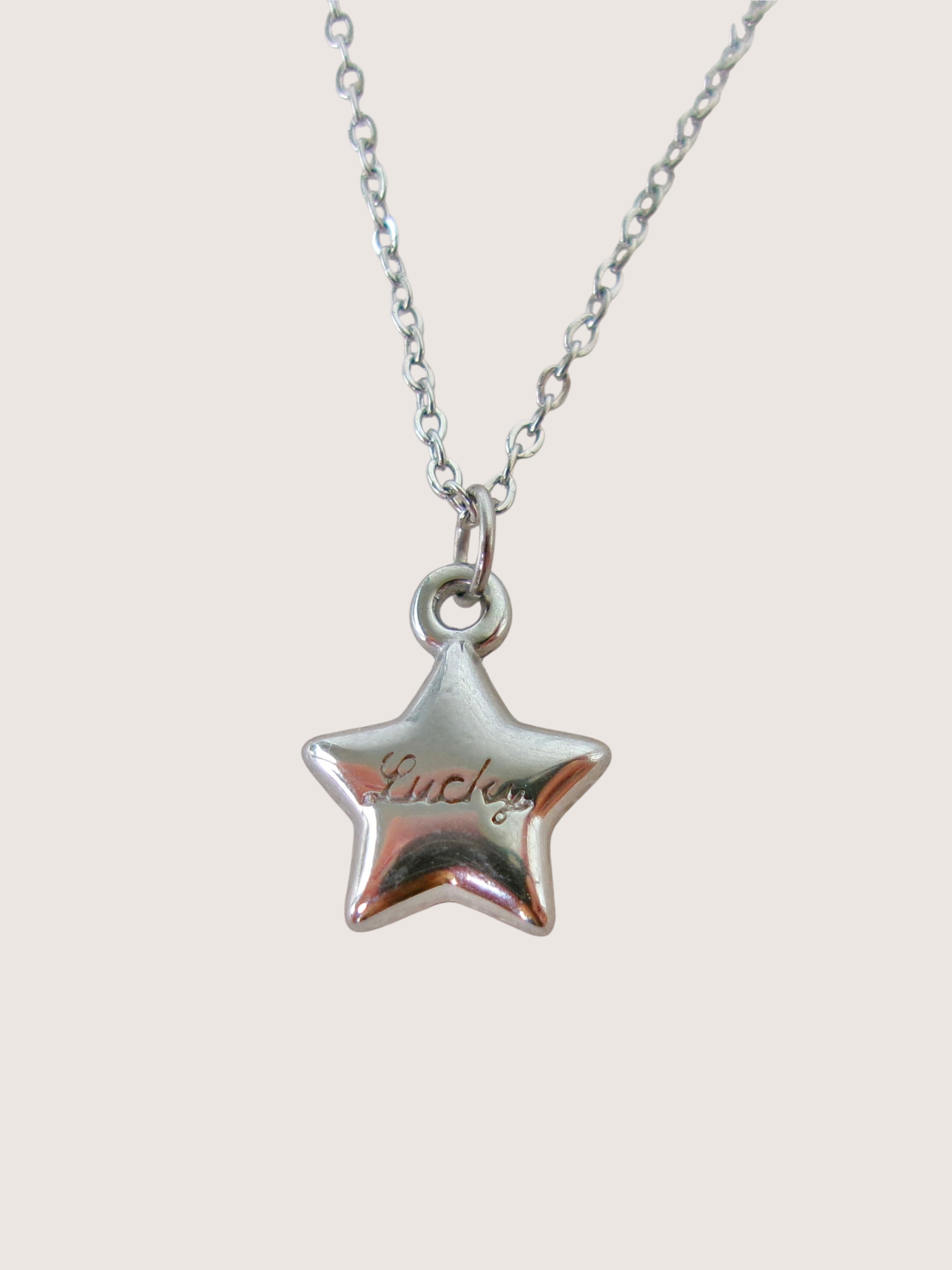 Lucky star pendant charm necklace. waterproof, silver stainless steel. Engraved 'Lucky'