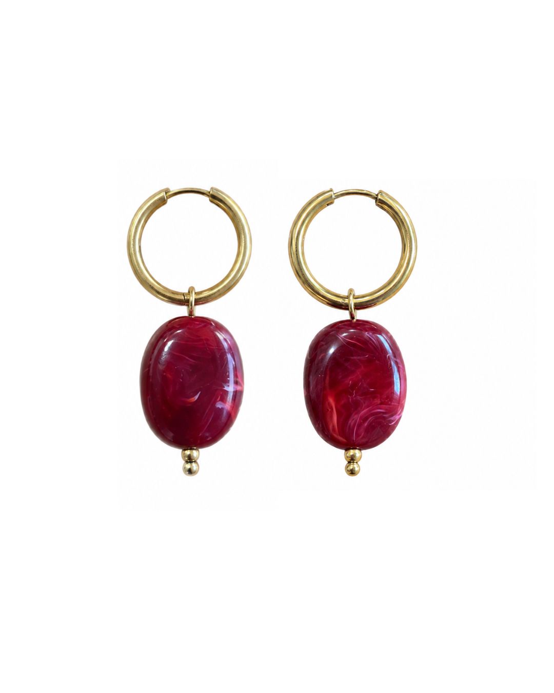 pair of gold hoop earrings with two red oval pendants.