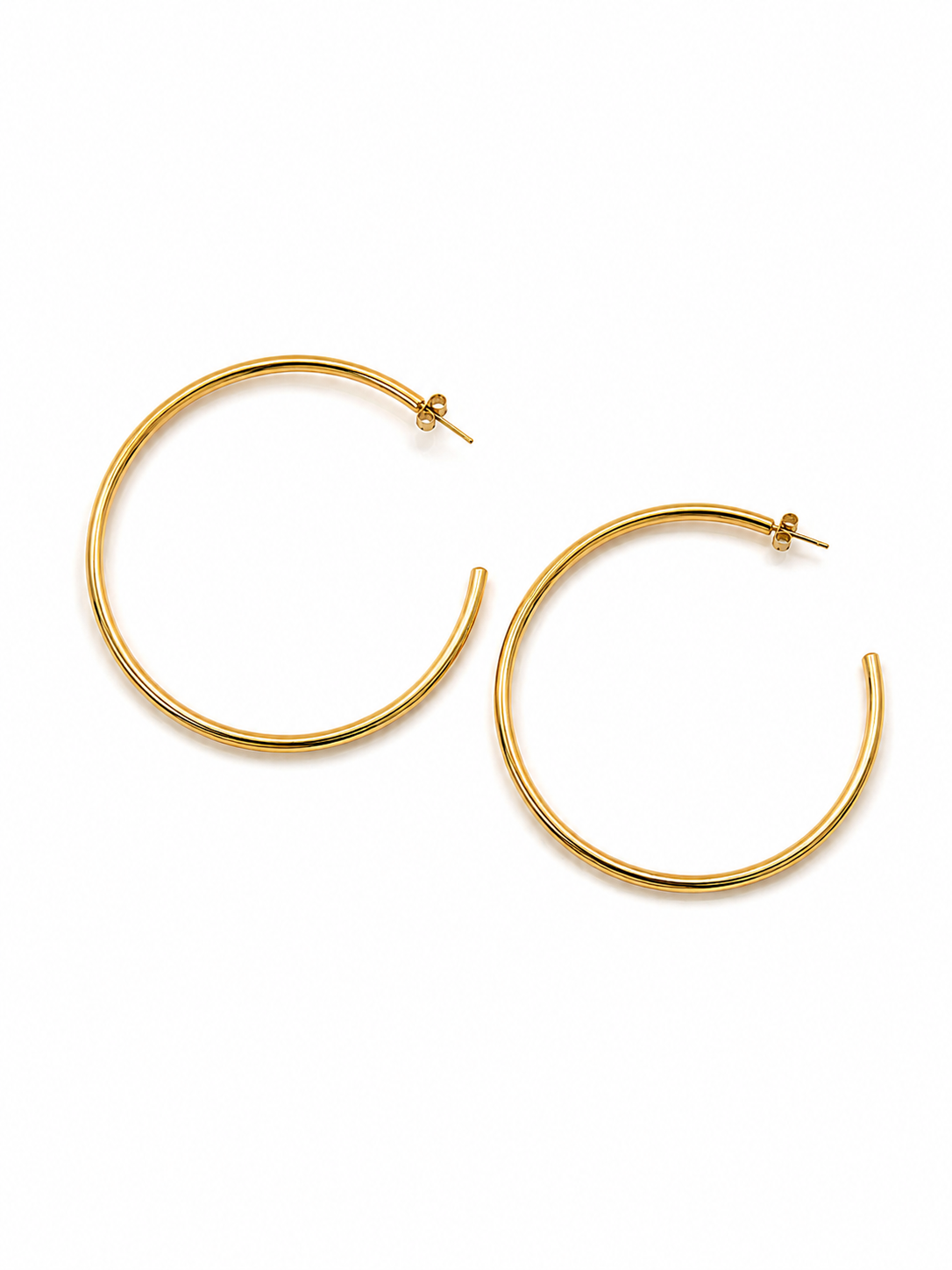 A pair of gold-toned open hoop earrings with post backings, displayed on a clean white background.