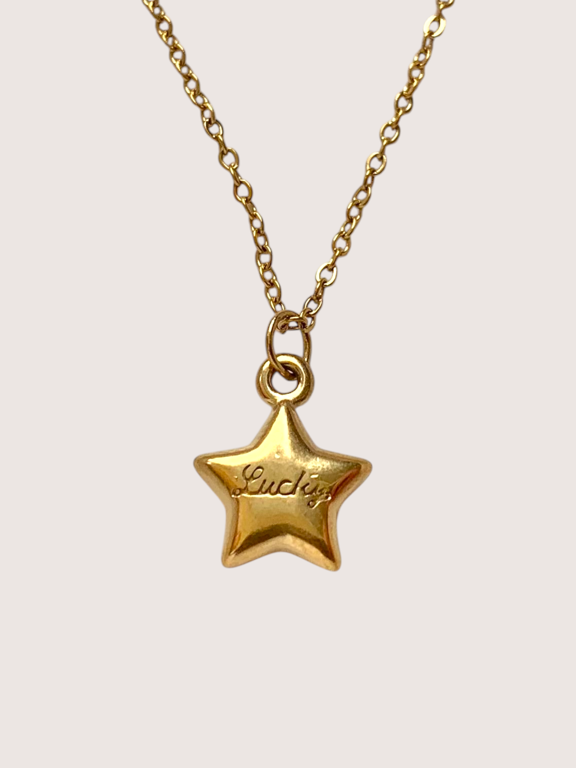 Lucky star pendant charm necklace. waterproof, 18k gold coated stainless steel. Engraved 'Lucky'