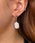 woman wearing natural freshwater pearl hoop earrings