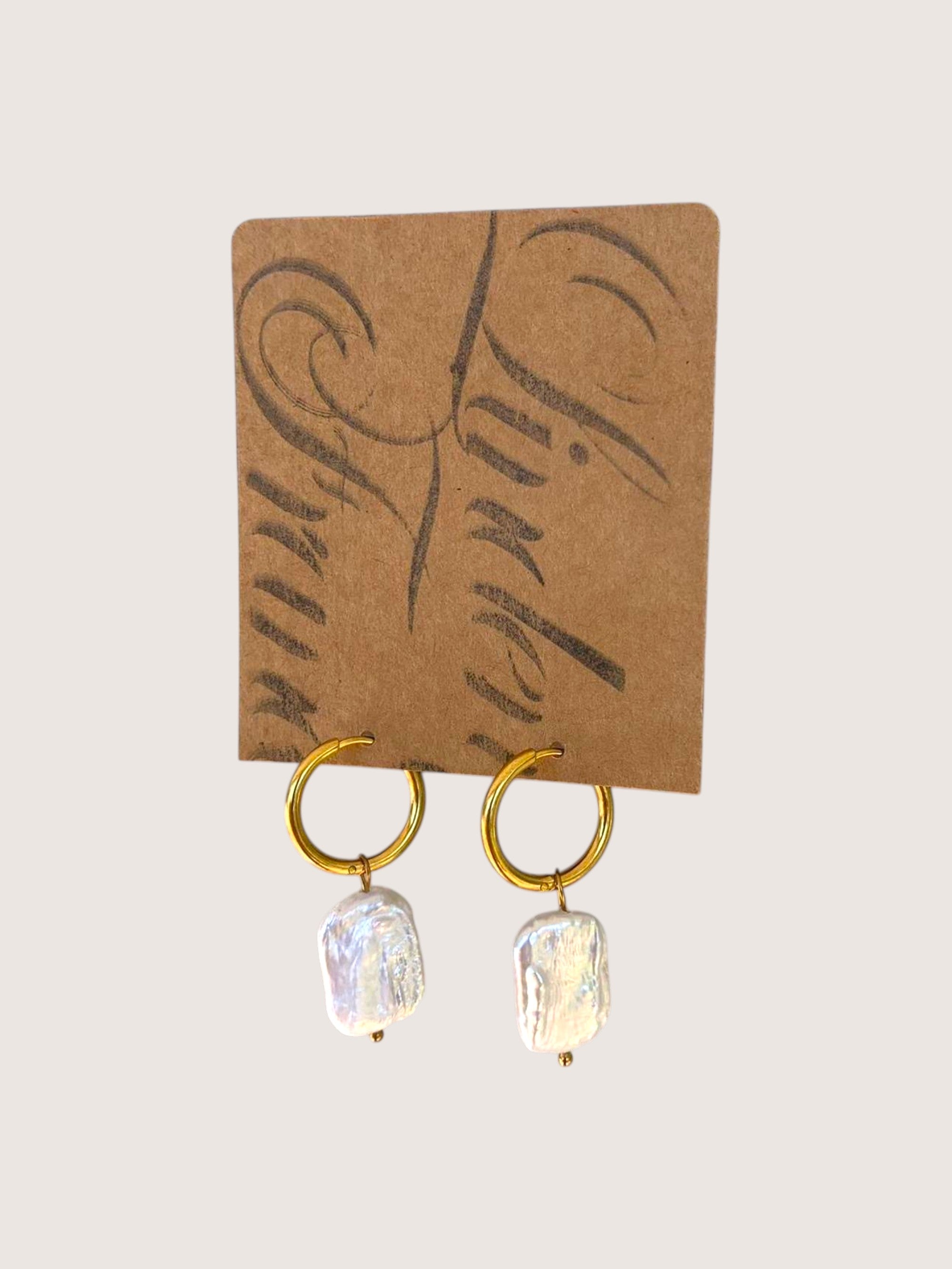 pearl hoops on a jeweller display card