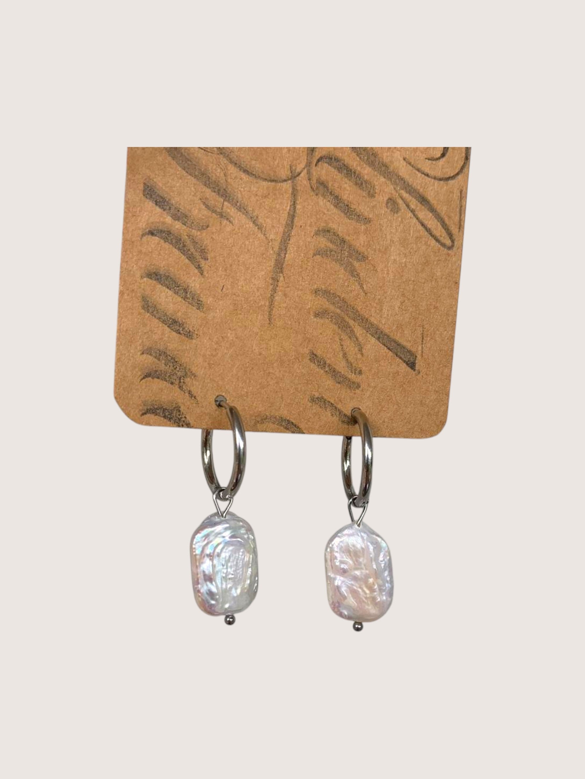 pearl hoops on a jewellery display card