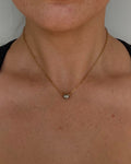 two toned stainless steel necklace. silver ball pendant