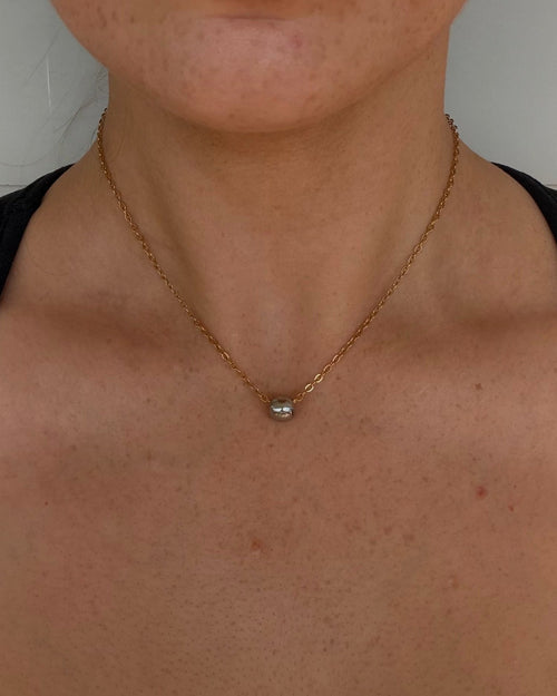 two toned stainless steel necklace. silver ball pendant